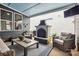 Relaxing covered patio includes a stone fireplace, outdoor seating, and mounted television at 1009 Hercules Dr, Indian Trail, NC 28079
