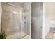 Shower with glass doors and tiled walls at 1009 Hercules Dr, Indian Trail, NC 28079