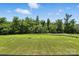 Expansive backyard featuring lush greenery and a serene tree line, viewed from the deck at 1019 Null Rd, Lincolnton, NC 28092