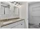 Bathroom featuring double vanity, granite countertops, and designer mirrors at 1019 Null Rd, Lincolnton, NC 28092