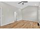 Cozy bedroom with hardwood flooring, neutral paint, and modern ceiling fan at 1019 Null Rd, Lincolnton, NC 28092