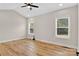 Spacious bedroom with hardwood floors and ample natural light from two windows at 1019 Null Rd, Lincolnton, NC 28092