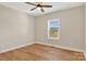 Neutral bedroom filled with hardwood floors and a window providing natural light at 1019 Null Rd, Lincolnton, NC 28092