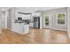 Bright kitchen with stainless steel appliances, white cabinets, and hardwood flooring at 1019 Null Rd, Lincolnton, NC 28092