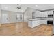 Open-concept kitchen with white cabinets, hardwood floors, and vaulted ceilings at 1019 Null Rd, Lincolnton, NC 28092