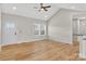 Open-concept living area boasts hardwood flooring, ceiling fan, and plenty of natural light at 1019 Null Rd, Lincolnton, NC 28092