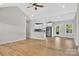 Spacious open-concept living area with hardwood floors flowing into a modern kitchen at 1019 Null Rd, Lincolnton, NC 28092