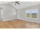 Sunlit living room features hardwood floors, neutral walls, and large windows at 1019 Null Rd, Lincolnton, NC 28092