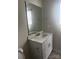 Cozy bathroom highlighting a quartz countertop vanity and under-sink storage space at 1022 Jeffery Dean Ct, Albemarle, NC 28001