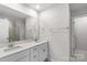 Bathroom features double sinks with white cabinetry at 1022 Jeffery Dean Ct, Albemarle, NC 28001