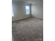 Neutral bedroom with plush carpeting and bright windows at 1022 Jeffery Dean Ct, Albemarle, NC 28001