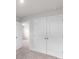 A bedroom featuring an open doorway, carpeted floor, and double door closet at 1022 Jeffery Dean Ct, Albemarle, NC 28001