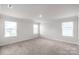 Carpeted bedroom with natural light streaming through the windows at 1022 Jeffery Dean Ct, Albemarle, NC 28001