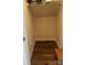 Walk-in closet features wood floors, white walls, and ample shelving for optimized storage solutions at 1022 Jeffery Dean Ct, Albemarle, NC 28001