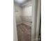Walk-in closet featuring adjustable wire shelving and plush carpet, providing ample storage space at 1022 Jeffery Dean Ct, Albemarle, NC 28001