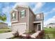 Two-story home showcasing a two-car garage, neatly kept lawn, and attractive curb appeal with landscaping at 1022 Jeffery Dean Ct, Albemarle, NC 28001