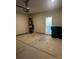 Spacious two-car garage with concrete floor, utility closet, and access door to the home's interior at 1022 Jeffery Dean Ct, Albemarle, NC 28001