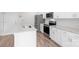 Open kitchen with stainless steel appliances, granite countertops, and a subway tile backsplash at 1022 Jeffery Dean Ct, Albemarle, NC 28001