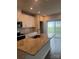 Open kitchen with granite countertops, stainless steel appliances, and natural light from the patio doors at 1022 Jeffery Dean Ct, Albemarle, NC 28001