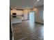 A bright living room features wood floors, modern lighting, and sliding glass doors to enhance natural light at 1022 Jeffery Dean Ct, Albemarle, NC 28001