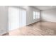 Bright living room with hardwood floors, large windows, and natural light creating a comfortable space at 1022 Jeffery Dean Ct, Albemarle, NC 28001