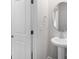 Stylish powder room featuring a pedestal sink and modern fixtures at 1022 Jeffery Dean Ct, Albemarle, NC 28001