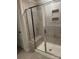 Modern shower with sleek glass enclosure, tiled walls, a built-in seat, and shower niche at 1022 Jeffery Dean Ct, Albemarle, NC 28001