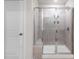 Shower featuring a glass door and tile walls at 1022 Jeffery Dean Ct, Albemarle, NC 28001