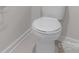 Close-up of a white toilet against the wall at 1022 Jeffery Dean Ct, Albemarle, NC 28001