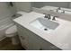 Bathroom with a white vanity, quartz countertop, brushed nickel hardware, and tub with shower at 11021 Scrimshaw Ln, Charlotte, NC 28215