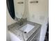 Bathroom with granite counters, white cabinets and updated lighting fixtures at 11021 Scrimshaw Ln, Charlotte, NC 28215