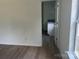 This bedroom leads into a bathroom with luxury vinyl plank flooring at 11021 Scrimshaw Ln, Charlotte, NC 28215