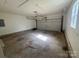 Spacious garage with an automatic door and ample space for vehicles and storage at 11021 Scrimshaw Ln, Charlotte, NC 28215