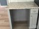 Kitchen shows gray cabinets, granite counters and modern hardware at 11021 Scrimshaw Ln, Charlotte, NC 28215