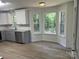 Kitchen featuring stainless steel dishwasher, granite countertops, and a breakfast nook with a view at 11021 Scrimshaw Ln, Charlotte, NC 28215