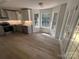 Bright kitchen featuring wood floors, recessed lights, stainless steel appliances, and plenty of windows for natural light at 11021 Scrimshaw Ln, Charlotte, NC 28215
