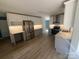 Spacious kitchen with stainless steel appliances, light countertops and backsplash, wood floors, and ample cabinet space at 11021 Scrimshaw Ln, Charlotte, NC 28215