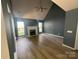 Spacious living room featuring a fireplace, high ceilings and lots of natural light at 11021 Scrimshaw Ln, Charlotte, NC 28215