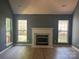 Spacious living room with vaulted ceiling, gas fireplace, and lots of natural light from many windows at 11021 Scrimshaw Ln, Charlotte, NC 28215
