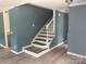 Stairway with updated gray wall color and white wood trim at 11021 Scrimshaw Ln, Charlotte, NC 28215