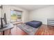 Bright bedroom with large window offering plenty of natural light and hardwood floors at 11049 Cedar View Rd, Charlotte, NC 28226