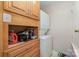 Functional laundry room featuring a stacked washer and dryer and ample cabinet storage at 11049 Cedar View Rd, Charlotte, NC 28226