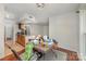 An inviting living room featuring dark wood floors and an open layout adjoining the kitchen, perfect for modern living at 11049 Cedar View Rd, Charlotte, NC 28226