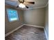 Bedroom with modern ceiling fan and updated flooring at 111 Rose St, Mount Holly, NC 28120