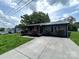 Charming home featuring a well-manicured lawn and landscaping with red roses at 111 Rose St, Mount Holly, NC 28120