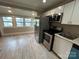 Bright eat-in kitchen features stainless steel appliances and durable, modern countertops at 111 Rose St, Mount Holly, NC 28120