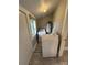 Well-lit laundry room with washer, dryer and water heater at 111 Rose St, Mount Holly, NC 28120