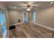 Bright living room featuring wood-look floors and a ceiling fan at 111 Rose St, Mount Holly, NC 28120