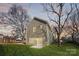Two-story home featuring a backyard with lush lawn and mature trees at 1117 Thayer Glen Ct, Charlotte, NC 28213