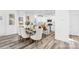 Open concept showcases dining area open to kitchen with bar stool seating, and ample natural light from nearby windows at 1117 Thayer Glen Ct, Charlotte, NC 28213